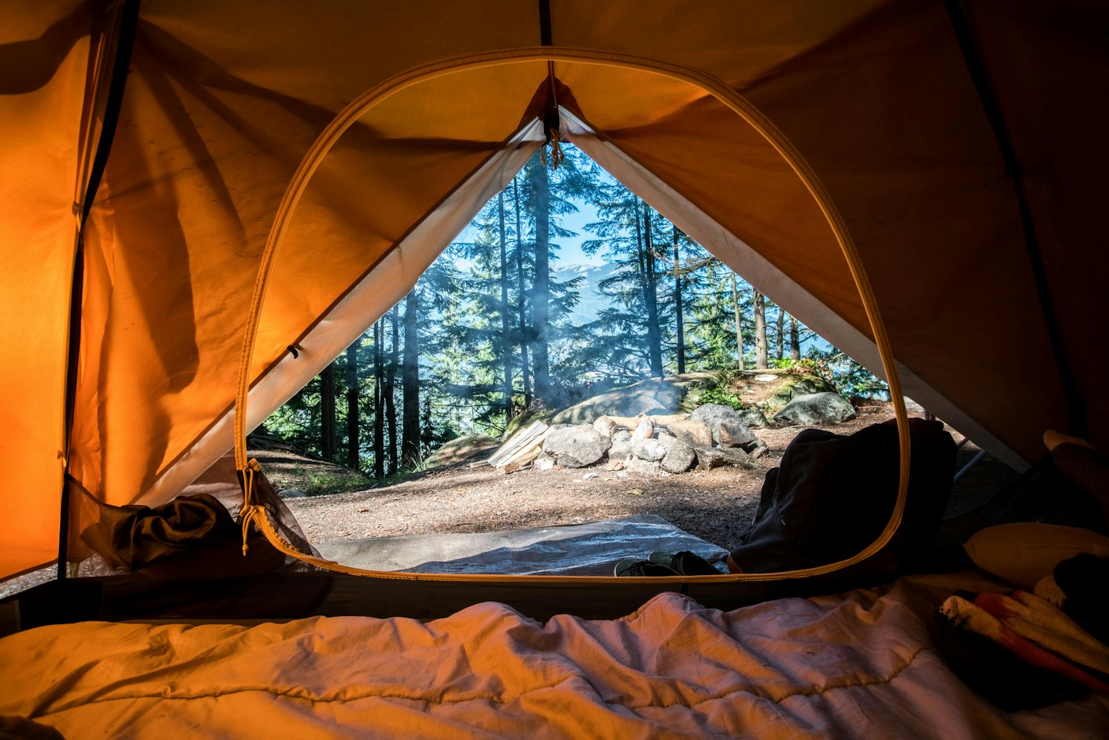 Luxury camping tent in a mountain forest setting